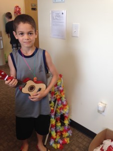 Kid playing a toy guitar at the dentist office