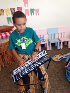 Kid playing piano at the dentist office