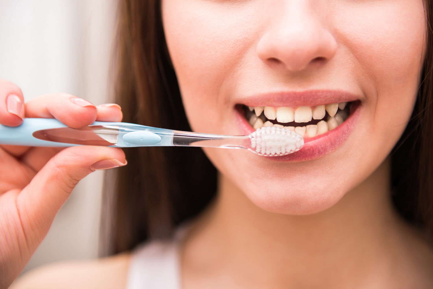 Woman brushing teeth